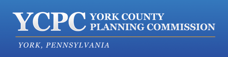 Blue background with white text, "YCPC York County Planning Commission" underneith this text is smaller white text, "York, Pennsylvania"