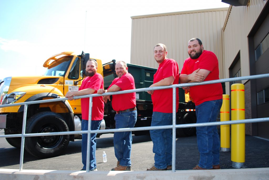 Dover Township Water Department group picture all wearing red shirts. From left to right, Mike Ladd, Matt McWilliams, Stanley Jett and Matthew Helwig.