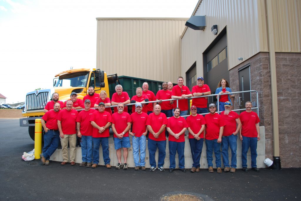 Dover Township Public Works Group picture everyone wearing matching red shirts.