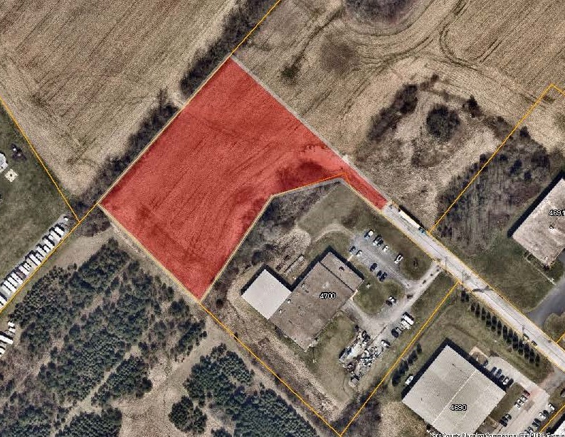 aerial map with the Raycom Rd Priority Parcel colored in red. Click to the map picture to be redirected to the Dover Township interactive zoning map.