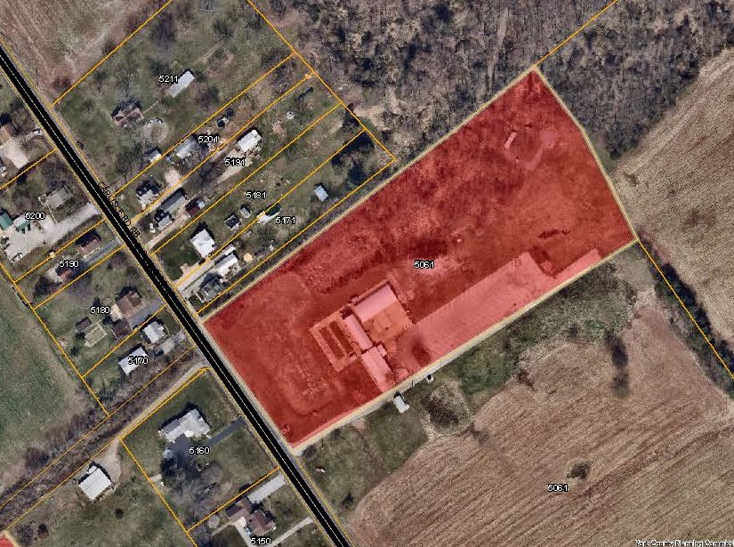 aerial map with 5061 Carlisle Rd Priority Parcel colored in red. Click to the map picture to be redirected to the Dover Township interactive zoning map.