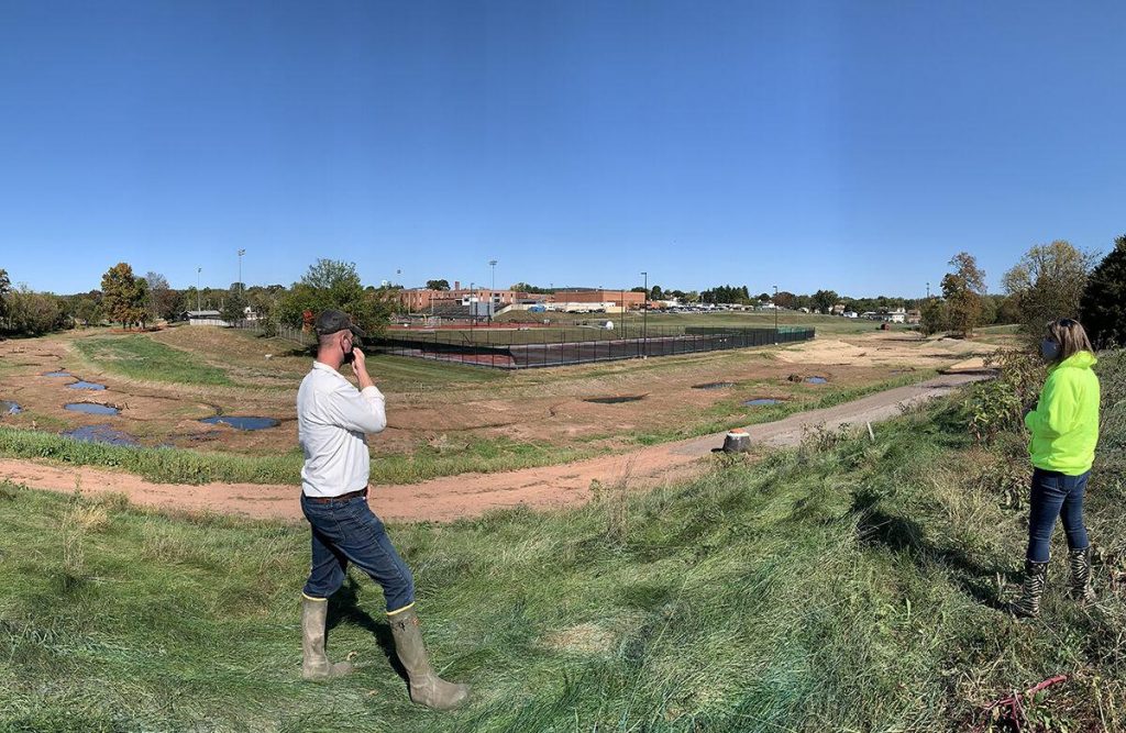 Reid Garner, left, of LandStudies, and Dover Township, PA, manager Laurel Oswalt look over a stream restoration where 27,000 cubic yards of “legacy” sediment was removed to reveal the original footprint and wetlands of two streams. Borough officials creatively used the floodplain restoration to get grants to form a multi-use park from a former golf course.