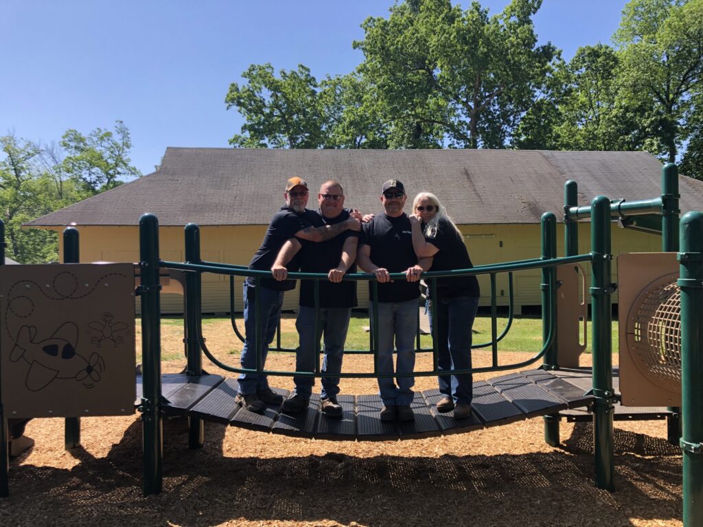 Dover Township Facilities & Parks Department Group Picture wearing black shirts. From left to right, Bill Barshinger, Rich Rudacille, Judd Wolfe and Tracy Kreiger,.